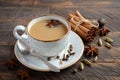 Indian masala chai tea. Spiced tea with milk on the rustic wooden table. Royalty Free Stock Photo