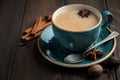 Indian masala chai tea. Spiced tea with milk on dark wooden background. Royalty Free Stock Photo