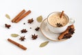 Indian Masala chai tea. Traditional Indian hot drink with milk and spices on white background closeup