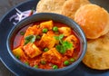 Indian meal matar paneer served with poori