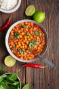 Indian meal, spicy chickpea curry with spinach in a bowl served with rice