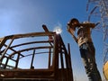 an indian mechanic belding on truck body during repairing work in India dec 2019