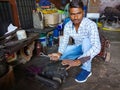 an indian mechanic boy repairing automobile parts at workshop in india dec 2019 Royalty Free Stock Photo