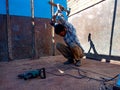 an indian mechanic man attack from hammer into the truck during repairing work at workshop in india dec 2019