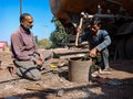 indian mechanics hammering during repairing task at workshop in india dec 2019 Royalty Free Stock Photo