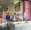 Indian men cooking street foods in Singapore