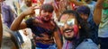 Indian men in goggles celebreting holi festival