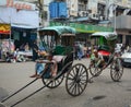 Indian men with rickshaws on street in Kolkata, India Royalty Free Stock Photo