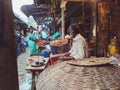 Indian men sitting on market in Visakhapatnam, India