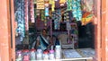 Indian Mother sitting in her home shop