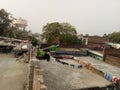 Indian middle class houses terrace with clothes hanging on rope ,and scene of government tank.