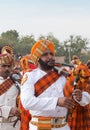 Indian military bagpipers band playing bagpipe during Camel festival in Rajasthan state, India Royalty Free Stock Photo