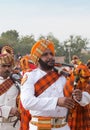 Indian military bagpipers band playing bagpipe during Camel festival in Rajasthan state, India