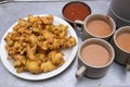 Indian milk tea, Chai, onion pakoda fried snack , Delhi Snacks popular deep fried