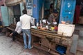 Indian milkman prepares the popular drink lassi in Blue lassi shop