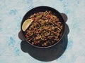 Indian minced meat Qeema on a sunny blue table.