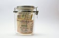 Indian Money or Rupee or currency or bank notes in glass jar