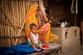 Indian mother and child in tea shop Royalty Free Stock Photo