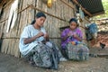Indian mother and daughter sitting crocheting