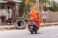 Indian motorcyclist, Puttaparthi, Andhra Pradesh, India. Copy space for text.