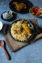 Indian mughlai delicacy chicken biryani in a cooking pan ready to be served . Royalty Free Stock Photo