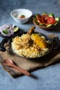 Indian mughlai delicacy chicken biryani in an cooking pan ready to be served . Royalty Free Stock Photo