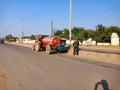 An indian munciple corporation labour sprey water on road side plant in india oct 2019