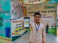 indian munciple corporation staff displaying clean India logo on mobile phone screen during awareness program January 2020