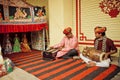 Indian musicians playing traditional songs on puppetry performance with toys