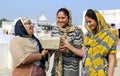 Indian Muslim Women Laugh With Radio Royalty Free Stock Photo