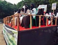 Indian muslim women& x27;s with poster,banners, and photograph sitting on a stage