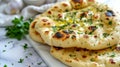 indian naan bread with herbs and garlic seasoning on plate,close up Royalty Free Stock Photo