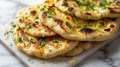 indian naan bread with herbs and garlic seasoning on plate,close up Royalty Free Stock Photo