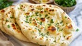 indian naan bread with herbs and garlic seasoning on plate Royalty Free Stock Photo