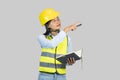 Female Asian Construction Engineer with chartboard and notebook gives expressions, gestures