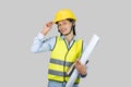 Female Asian Construction Engineer with chartboard and notebook gives expressions, gestures