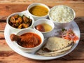 Indian Non-Veg Thali / food platter consists variety of veggies,Chicken meat, lentils, sweet dish, snacks etc., selective focus Royalty Free Stock Photo