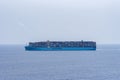 Maersk owned cargo container ship sailing through the ocean.