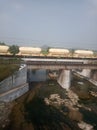 indian oil tanker train on rail bridge