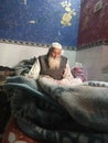 Indian old man rest on bed