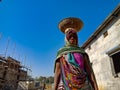 an indian old woman transporting building material during home construction on site in India January 2020 Royalty Free Stock Photo