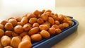 Indian organic peanuts isolated on blue container cap.