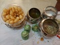 Indian paani puri or local name puchka or golgappa along with its ingredient and small plates Royalty Free Stock Photo