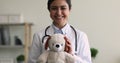 Indian paediatrician holding fluffy toy smile look at camera