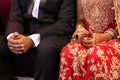 Indian Pakistani Couple sitting and enjoy the ceremony