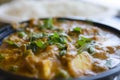 Indian paneer curry dinner topped with green leaves with rice in Royalty Free Stock Photo