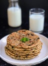 Indian Parantha (stuffed indian bread) and milk Royalty Free Stock Photo