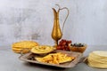 Indian party table with hummus, bread and copper jug Royalty Free Stock Photo