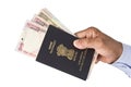 Indian Passport and Indian Rupees in hand Royalty Free Stock Photo