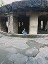 Indian pataleshwar temple in stone at sitting girl